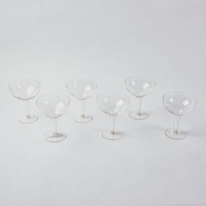 A Collection Of Six Hollow Stemmed Etched Champage Coups