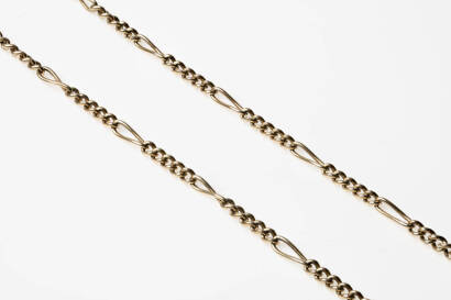 Two gold chains and a gold cross. 9ct yellow gold. Total weight 42.3 grams.