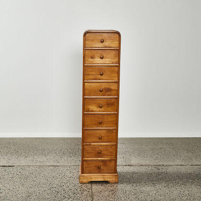 A Tall Wooden Drawer Unit