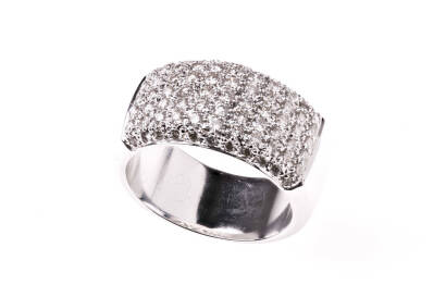 A diamond ring, seventy-seven round brilliant diamonds of estimated weight 1.0 carat are pave set in a 10mm band. 18ct white gold. Weight 13.9 grams. Size N.&nbsp;