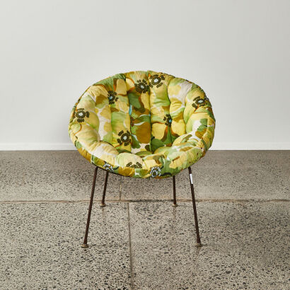 A Retro Coolie Style Chair With Floral Upholstery