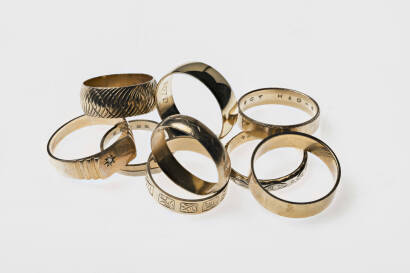 Nine various wedding band rings. Seven 9ct yellow gold. Weight 25.9 grams. One 18ct yellow and white gold. Weight 3.5 grams. One brass.
