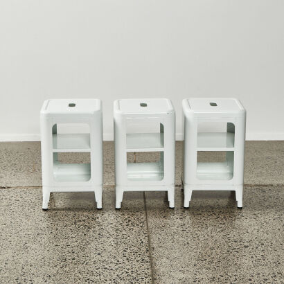 A Trio Of White Metal Storage Stools