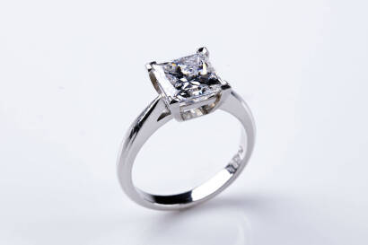 A 3.20 carat diamond solitaire ring, the corner set princess cut diamond of known weight. Platinum. Weight 6.8 grams. Size M.&nbsp;