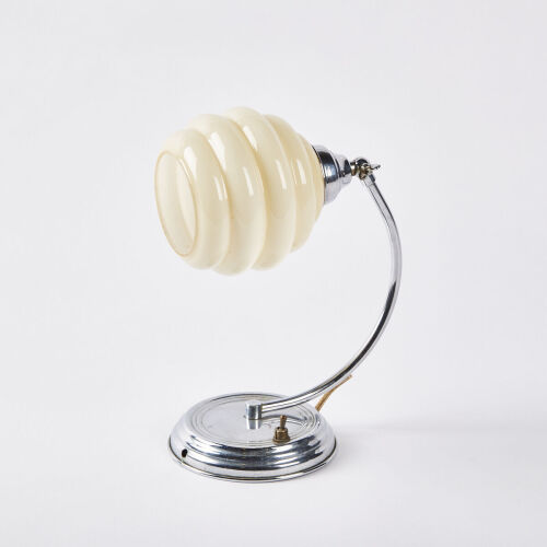 An Art Deco Lamp With A Beehive Shade