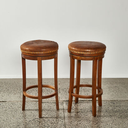 A Pair Of Leather Topped Bar Stools