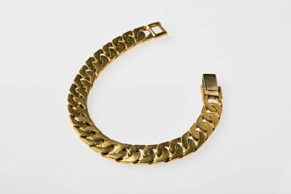 A flat curb link bracelet, 24ct/18ct yellow gold. Weight 55.68 grams. Length 18cm.