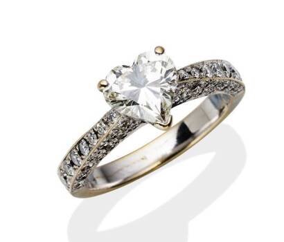 A 1.50 carat solitaire diamond ring, claw set with a heart-shaped diamond of known weight, round brilliant cut diamonds to shoulders. 18ct white gold. Weight 4.86 grams. Size M&frac12;. Accompanied by EGL Certificate number US UD044192301, dated April 5, 2001 st