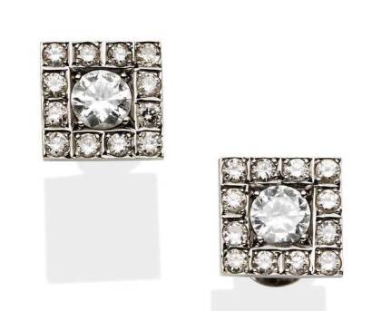 A pair of diamond ear studs, of square cluster design, each set with a central round brilliant cut diamond of estimated weight 0.35 carat, in a square border of diamonds. 9ct white gold. Weight 3.35 grams. Post and butterfly attachments.