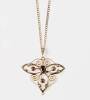 An Edwardian seed pearl, clear stone and garnet pendant. Yellow gold.&nbsp;Length 37mm. (Drop deficient). With base metal chain.