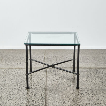 A Wrought Iron Side Table With Glass Top