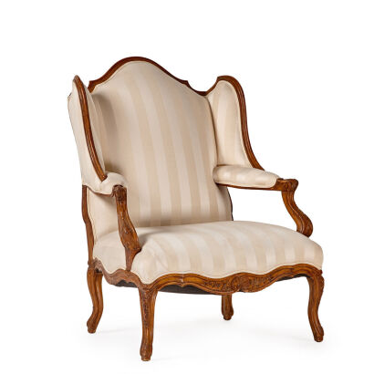 A Pair of French Louis XV Style Walnut Carved Wingback Fauteuil