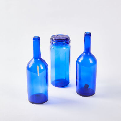 A Trio Of Vintage Blue Glass Bottles