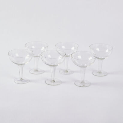 A Set Of Six Starburst Etched Hollow Stem Champagne Coupes