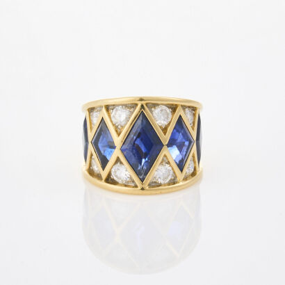 An 18ct Yellow Gold, Modern 10.73ct Sapphire and 1.53ct Diamond Dress Ring