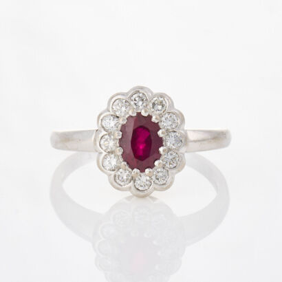 18ct White Gold, 1.28ct Oval Ruby and .43ct Diamond Ring