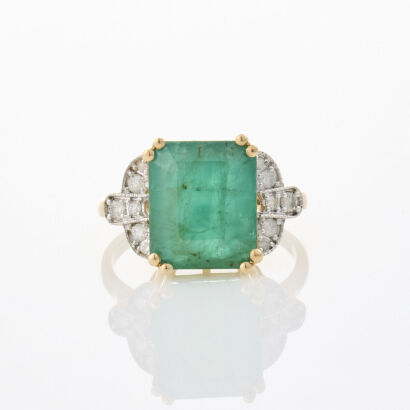 A modern, 9ct Yellow Gold, 5.69ct Emerald and .18ct Diamond Ring