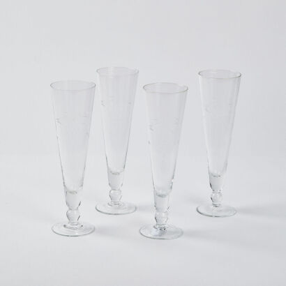 A Set Of Four Vintage Grape Etched Champagne Flutes