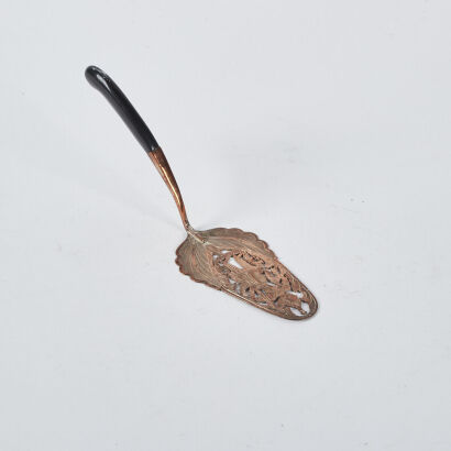 An Antique Copper Coated Sterling Silver Cake Server