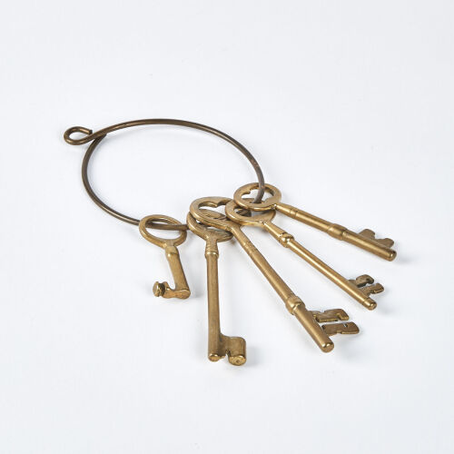 A Collection Of Five Large Brass Keys On A Ring