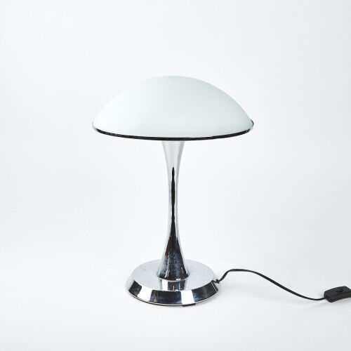 A Modernist Table Lamp With A Chrome Base And Frosted Glass Top