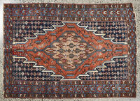 A Persian Hand-Knotted Rug