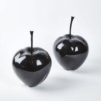 A Pair Of Large Black Apples