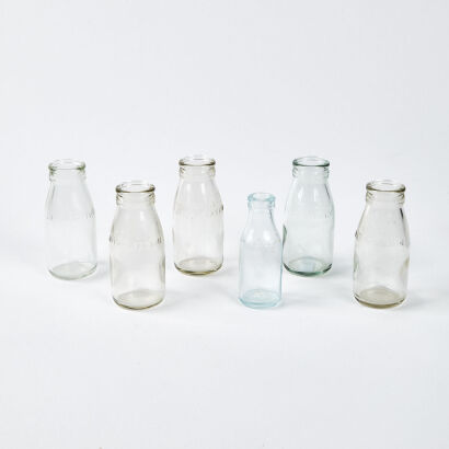 A Collection Of Six Vintage Glass Milk Bottles