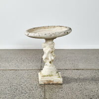 A Concrete Cherub Birdbath