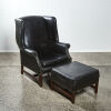 A Wingback Library Chair with Footstool & Studded Detailing