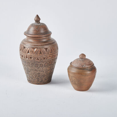 A Pair Of Ceramic Lidded Pots