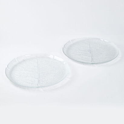 A Pair Of Round Glass Leaf Platters