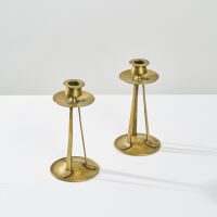 A Pair of English Arts and Crafts Brass Candlesticks by May and Padmore