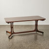 An Italian Rosewood Stretcher Base Dining Table