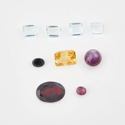 A Collection of Nine Loose Gemstones, Oval, Garnet, Citrine, Star Ruby, Aquamarine, And Sapphires