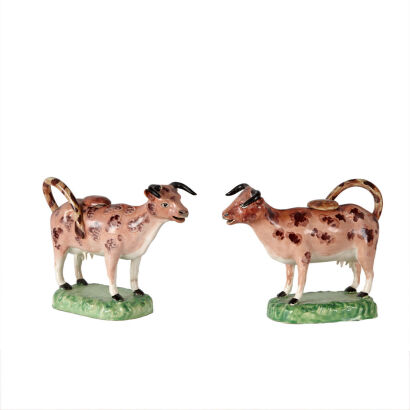 A Rare Pair of Swansea Cambrian Pearlware Cow Creamers