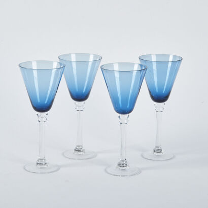 A Set Of Four Blue Glass Wine Glasses