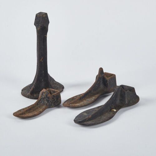 A Collection Of Antique Cast Iron Cobblers Forms