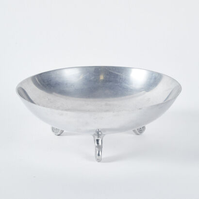 A Metal Decorative Bowl with Swirl Feet