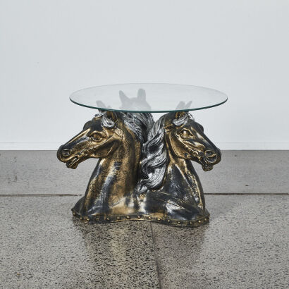 A Horse Head Based Table With A Glass Top