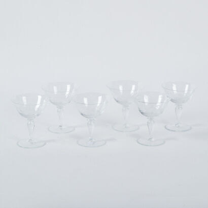 A Collection Of Six Etched Champagne Coupes