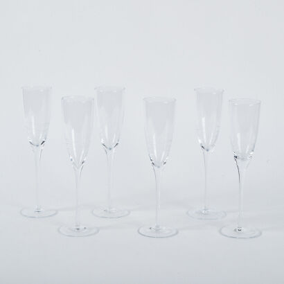 A Set Of Six Wave Etched Champagne Flutes