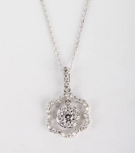 A diamond pendant, the central diamond cluster suspended from a diamond set frame, known total weight 1.0 carat. 18ct white gold. Weight 3.6 grams. Length 25mm. To be sold with a fine trace link chain. 18ct white gold. Weight 1.5 grams. Length 45cm.