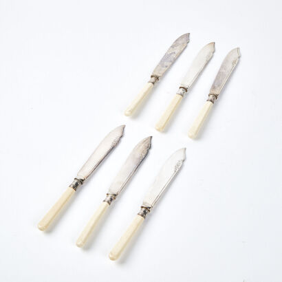 A Set Of Six Silver Plate Knives