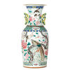 A Qing Dynasty Famille Rose Lidded Vase with bird and flower pattern and two ears