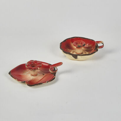 A Pair of Red Enamel Antique Wee Willie Winkie Candle Holders