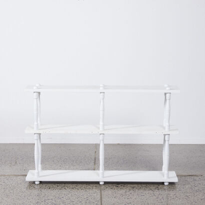 A White Bookshelf with Bannister Detailing