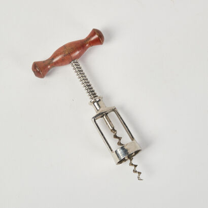 A Vintage European Spring Loaded Corkscrew with Wooden Handle