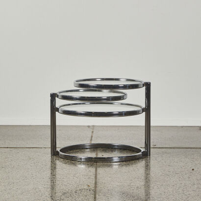 A Chrome and Tempered Glass Swivel Coffee Table in the Style of Milo Baughman