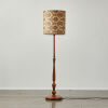 A Mid Century Floor Lamp With Solid Wood Base